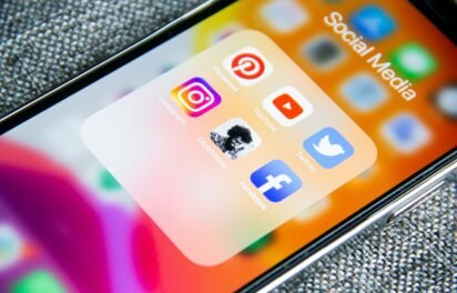 social media marketing for small business — phone showing social media apps and engagement social media marketing for small business — phone showing social media apps and engagement